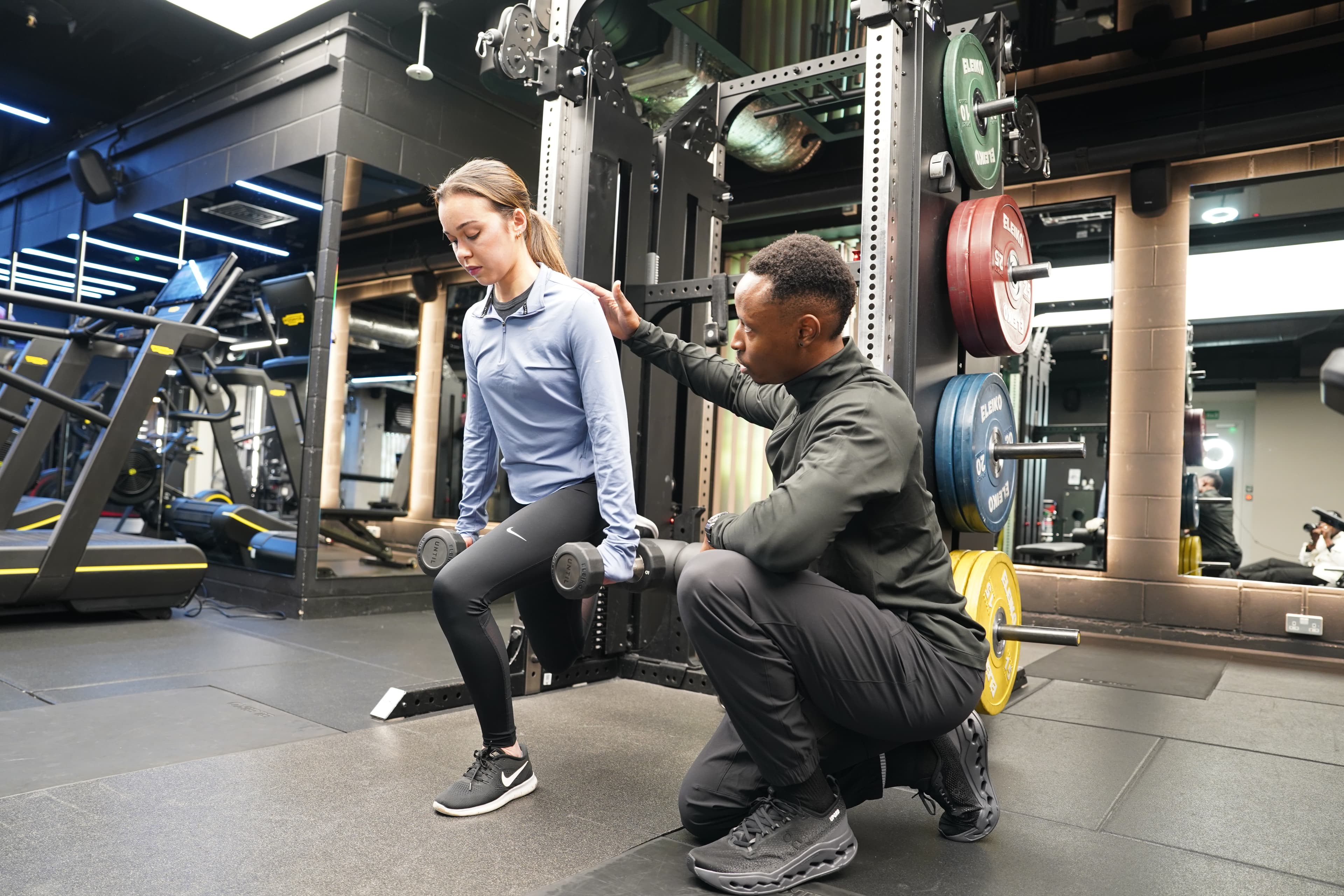 Brendon Kawondera coaching client through precision training technique in private gym